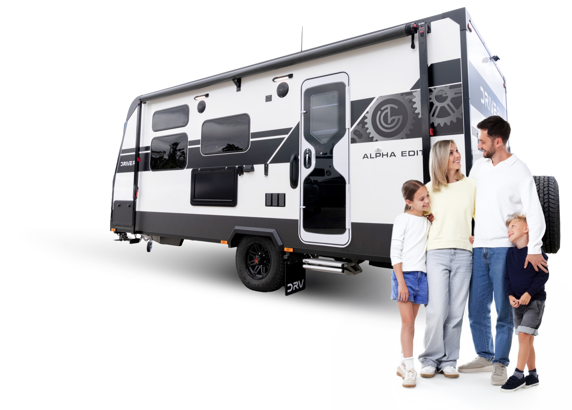 Family standing beside a Drive RV Alpha Edition caravan